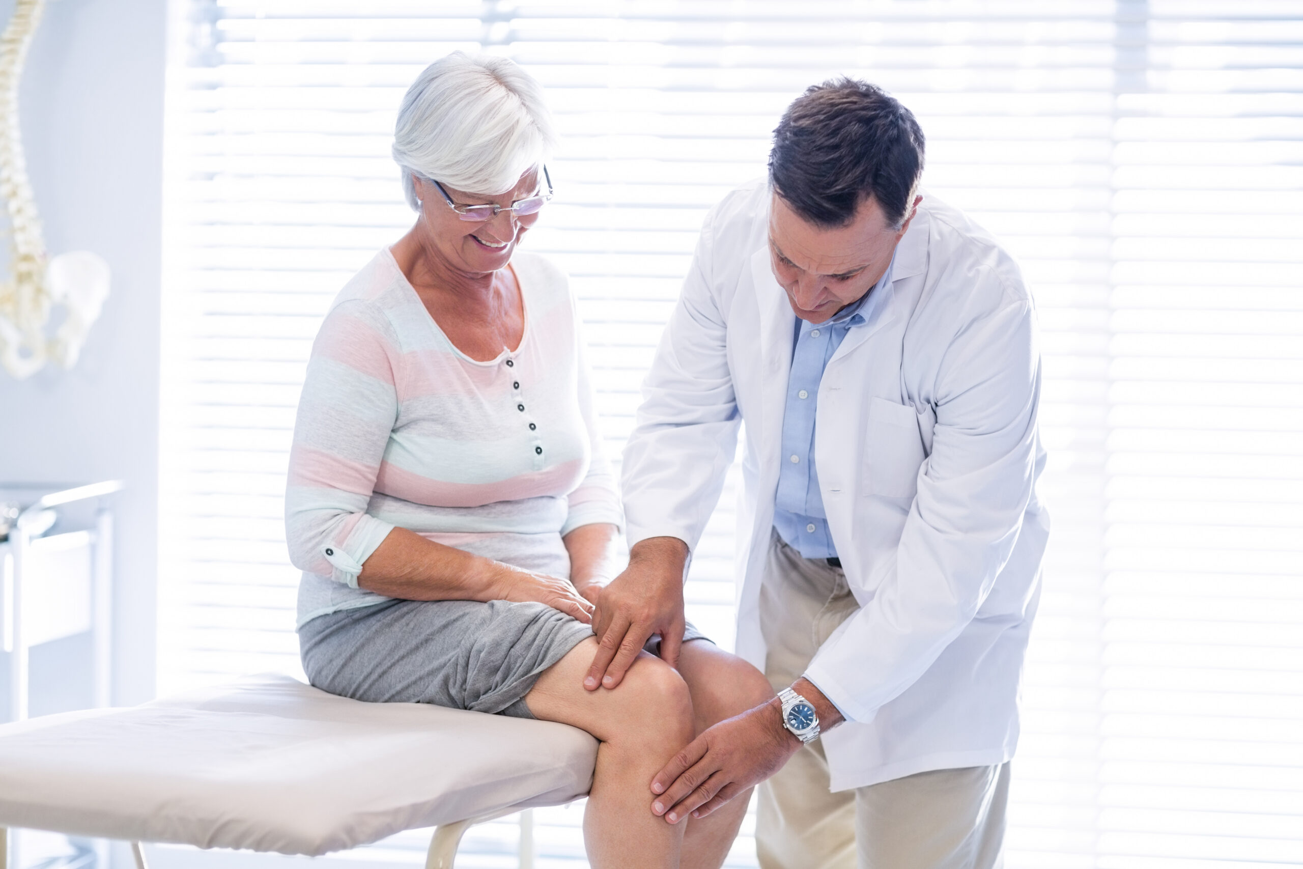 Provider evaluating a patient's joint mobility